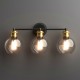 Modern 3-light bubbled glass vanity light showcasing the elegant globe shades, perfect for enhancing any bathroom.