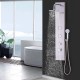 Stainless steel shower panel with waterfall head, hand shower, and rotating massage jets for a luxurious shower.
