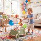Baby push walker in green with a foldable handlebar and large storage basket, ideal for play and organization.