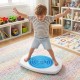 Child joyfully balancing on the Balance Board Maze, designed with an anti-slip surface and three maze discs for safe play.