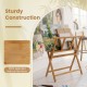 Bamboo art print rack features sturdy X-shaped support legs and a middle shelf for displaying canvases and artwork.