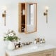 Bamboo small medicine cabinet with mirror door, featuring removable shelves for customized storage in natural finish.