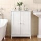White bathroom floor storage cabinet with double doors and shelves, perfect for organizing toiletries and essentials.