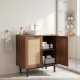 Freestanding bathroom vanity cabinet with rattan doors, U-shaped cut-out, and metal legs for stylish storage.