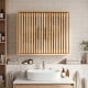 Bathroom wall cabinet with slatted doors and adjustable shelves, perfect for organized storage in any space.