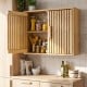 Natural wood wall cabinet with slatted doors and adjustable shelves, perfect for bathroom or kitchen storage.