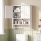 Bathroom wall cabinet in white with adjustable shelf, towel bar, and open storage for towels and toiletries.