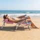 Portable folding beach chair set in gradient pink, featuring 5-position backrest and padded headrest for ultimate.