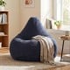 Blue bean bag chair with skin-friendly corduroy cover and soft sponge filling, perfect for lounging in any room.