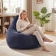 Blue bean bag chair with corduroy cover and soft sponge filling, perfect for reading and relaxing in any room.