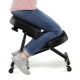 Adjustable ergonomic kneeling chair in black with thick foam cushions, designed for comfort and backache relief.