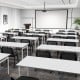 Stackable conference chairs with mesh back and curved design, ideal for office gatherings and space-saving solutions.