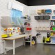 Ductless mini split air conditioner and heater with remote control, designed for spaces up to 450 sq.ft, in a workshop.