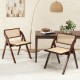 Foldable dining chairs set of 2 with woven rattan backrest and sturdy rubber wood frame, ideal for space-saving storage.