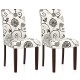 Set of 2 button tufted dining chairs with beige floral fabric and sturdy rubber wood legs for versatile seating.