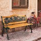 Outdoor bench with rose pattern backrest, solid wood seat, and cast iron frame, perfect for patio seating.