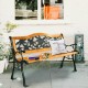 Outdoor bench with a rose pattern backrest, made of cast iron and solid wood, perfect for patio seating.