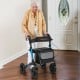 Folding rollator walker with seat, ergonomic grips, large storage bag, designed for seniors and all-terrain use.