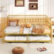 Twin daybed with curved backrest and armrests in gold, featuring a pull-out trundle for extra sleeping space.