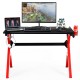 Ergonomic gaming desk with carbon fiber surface, R-shape steel frame, and accessories for organized gaming setup.