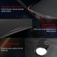 Close-up of the ergonomic gaming desk's rounded corner and cable management grommet, featuring a carbon fiber surface.