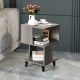 Stylish wooden nightstand with legs, showcasing an asymmetrical design and smooth surface for easy cleaning in any room.