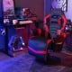 Massage video gaming recliner chair in red with adjustable height, swivel seat, and retractable footrest for comfort.
