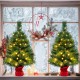 Mini pre-lit 24-inch Christmas tree with warm white LED lights, red cloth base, perfect for festive tabletop decoration.