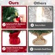24-inch mini pre-lit Christmas tree with warm white LED lights and a stable cement base wrapped in a festive red cloth.