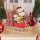 Christmas metal sleigh decoration in vibrant red with 2-tier storage shelf, perfect for displaying gifts indoors or.