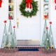 Three tower-shaped Christmas trees in varying heights with removable star toppers, featuring festive patterns for.