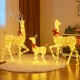 Lighted family deer set with 221 LED lights, featuring a sturdy metal frame and decorative bows for festive elegance.