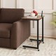 C-shaped end table in rustic brown with wheels, phone slot, and spacious top for snacks, fitting snugly beside a couch.