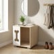 Wooden cat bed side table with bone-shaped window, natural finish, and sturdy metal legs for stylish pet comfort.