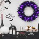 24-inch pre-lit Halloween wreath with 35 purple LED lights, featuring lifelike branch tips for a spooky festive.