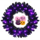 24-inch pre-lit Halloween wreath with 35 purple LED lights, featuring lifelike branches for festive decoration.