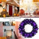 24-inch Halloween wreath with 35 purple LED lights, designed for doorways to create a spooky festive atmosphere.