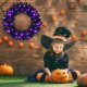 24-inch pre-lit Halloween wreath with 35 purple LED lights, enhancing festive spirit in a spooky outdoor setting.