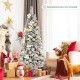 Snow flocked 6ft Christmas pencil tree with white berries and flowers, showcasing a charming design for holiday.