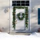 9FT pre-lit artificial Christmas garland adorned with red berries, pine cones, and 100 LED lights, ideal for cheerful.