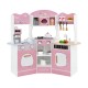 Corner wooden play kitchen in pink with coffee machine, slide, and interactive features for kids' imaginative play.