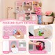 Wooden play kitchen in pink featuring a slide, sink, oven, and coffee machine for immersive pretend play.