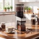 Conical burr coffee grinder in silver with digital display, 60 settings, and 8.8 oz bean hopper for precise grinding.