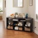 Corner entertainment center TV stand in black, designed for TVs up to 55 inches, with ample storage and adjustable.