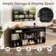 Corner entertainment center TV stand in black with ample storage, adjustable shelves, and space for TVs up to 55 inches.