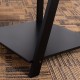 Close-up of the black MDF base of a 4-tier ladder bookshelf, showcasing its modern design and sturdy construction.