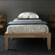 Twin size wooden slats bed frame in natural finish with 14-inch height and under-bed storage for a modern bedroom.