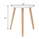 Modern round coffee table with a white MDF top and pine wood legs, measuring 16 inches in diameter and 19 inches tall.