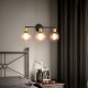 Modern 3-light bubbled glass vanity light with three globe shades, creating a warm ambiance for stylish bathroom spaces.
