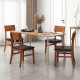Set of two dining chairs with rubber wood legs and black faux leather seats, perfect for kitchen or dining room use.